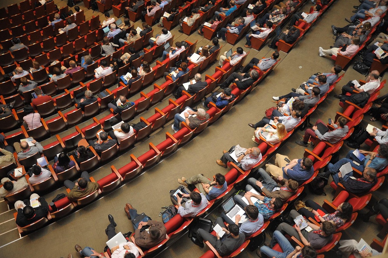 An audience gathered in an auditorium